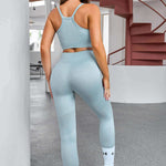 Light blue workout set consisting of a sports bra and high-waisted leggings